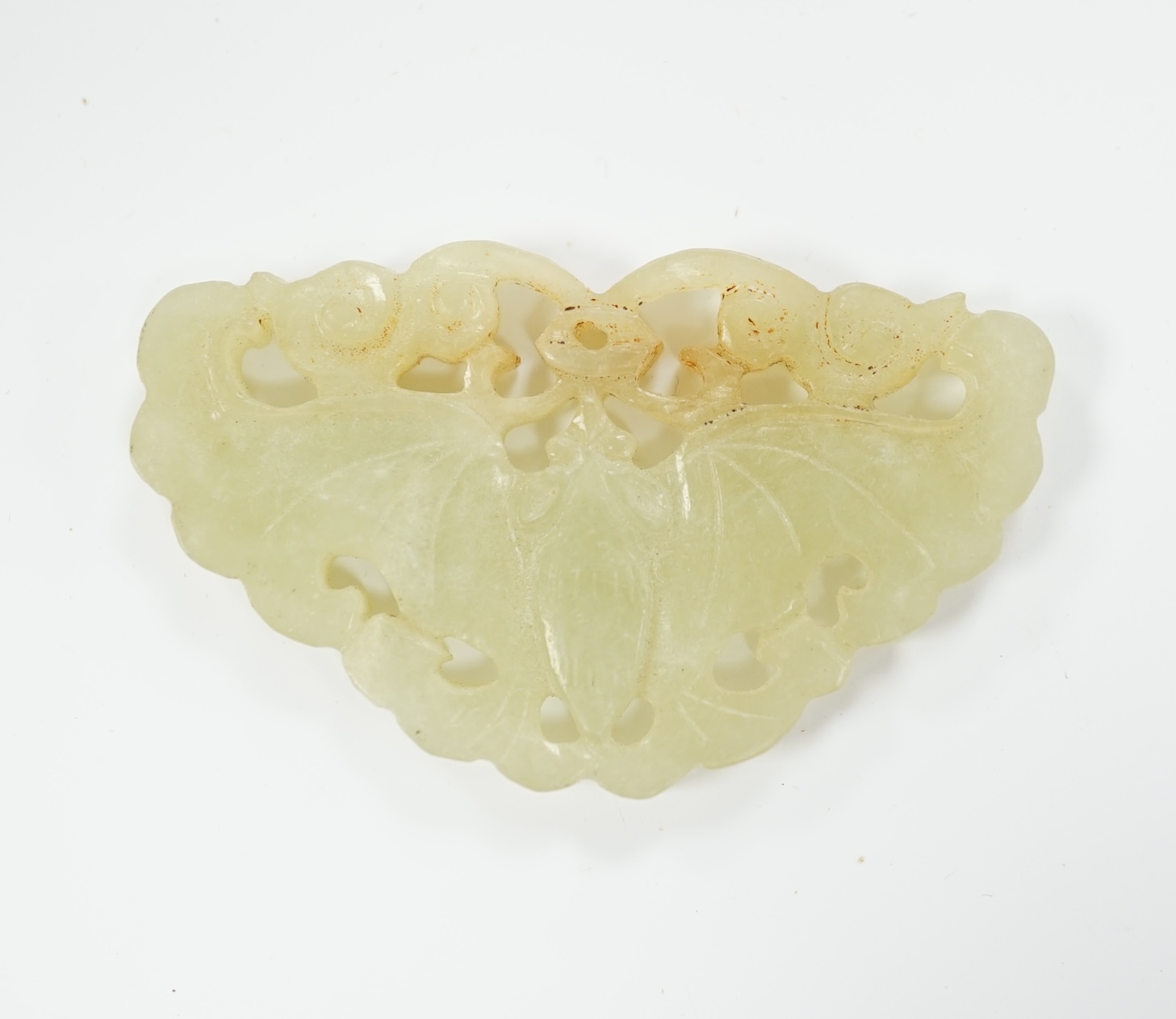 A Chinese carved jade plaque, 5.2cm wide